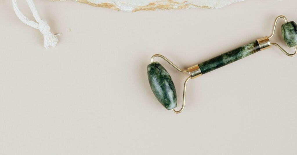 best amazon wellness finds under $30 - jade rollers flat lay on neutral background