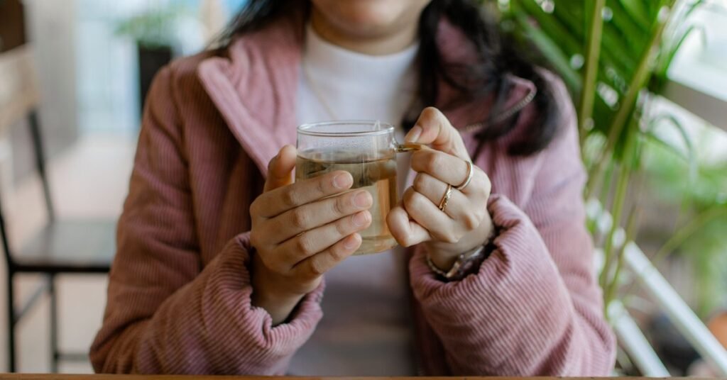 herbal tea for menopause symptoms held in a woman's hands
